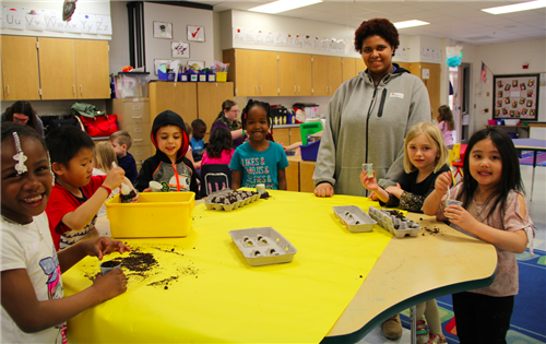 CRHS students partner with kindergarteners to plant seeds in celebration of Earth Day 